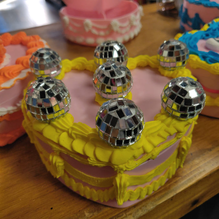Yellow icing with disco balls